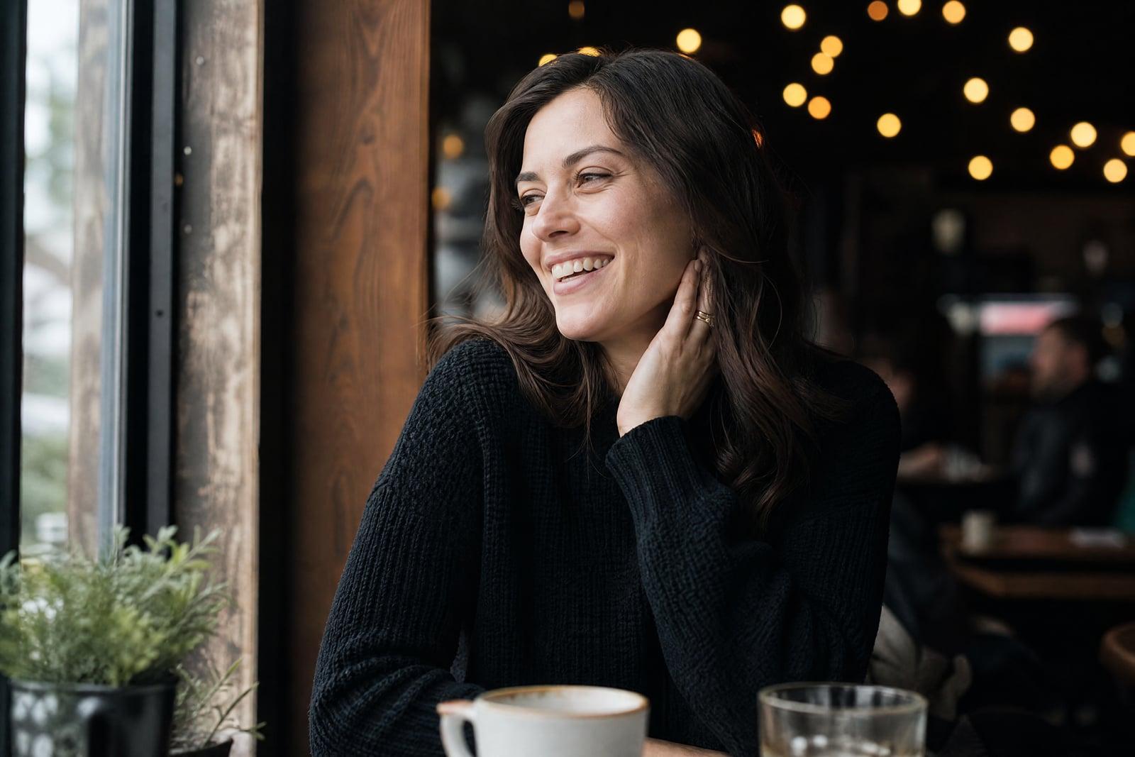 AI Dating Photos example: natural, flattering profile photo in a warm cafe setting