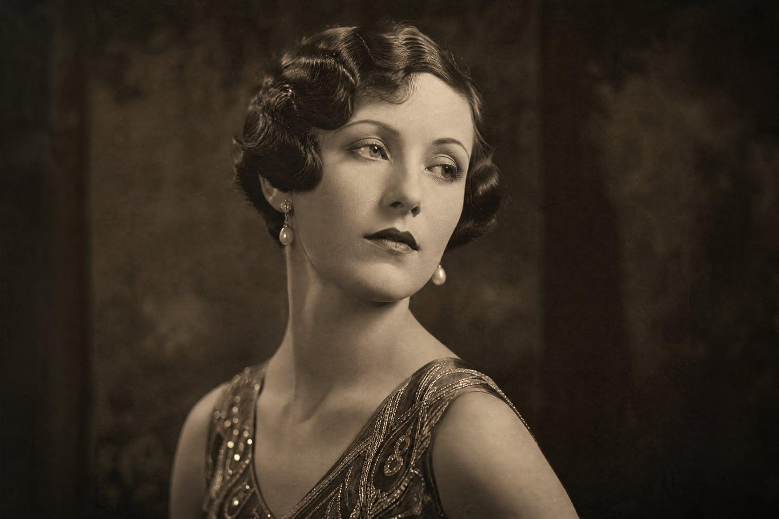 Historical Portrait of a woman as a 1920s jazz-age icon in period monochrome studio style