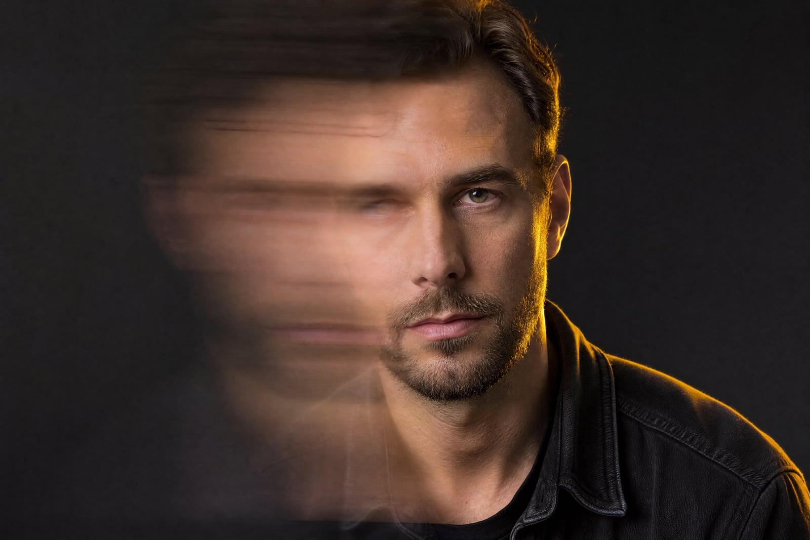 Unblur Image restoring a motion-blurred portrait to crisp, clear focus